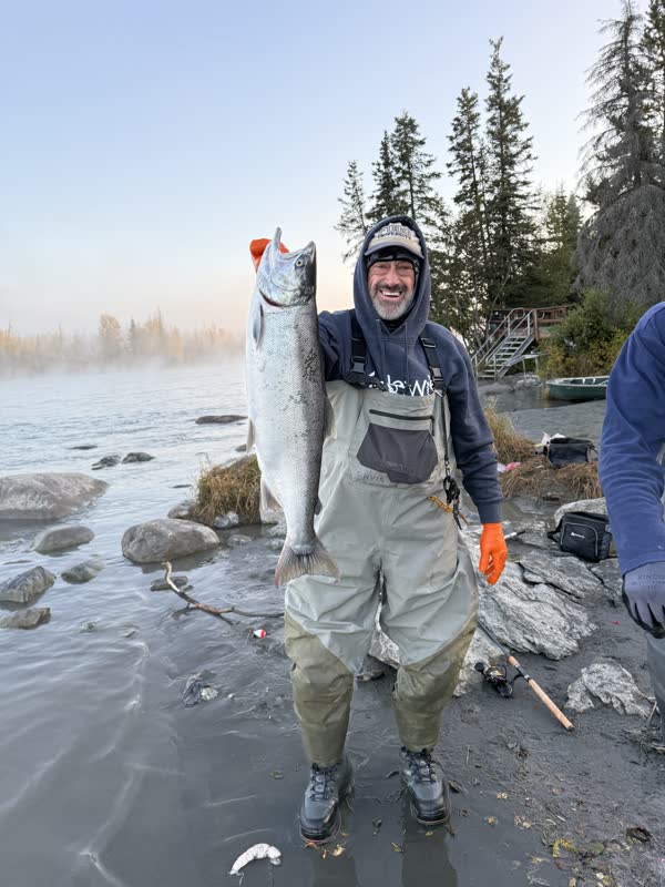 Angler holding a Kenai River sockeye salmon